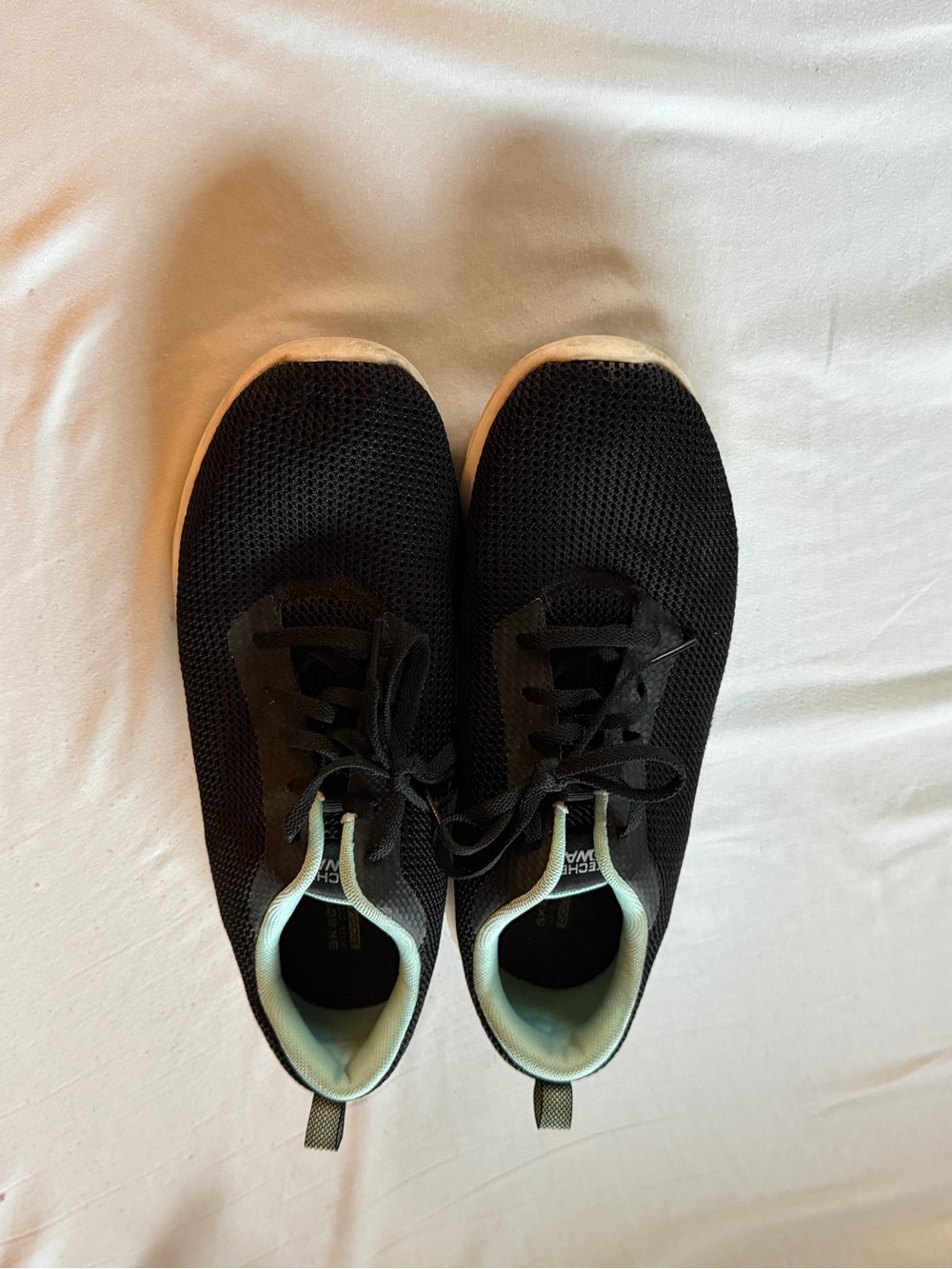 Womenโs Sketchers Black Knit Athletic Sneakers